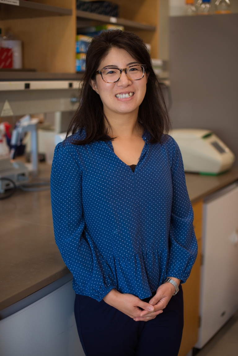 Pulin Li stands smiling in her lab.