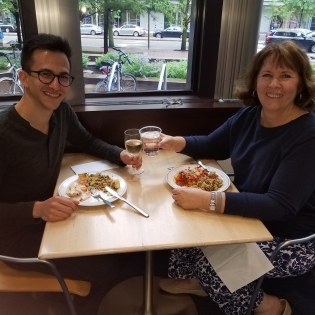Two teachers eating at the Whitehead Institute Cafeteria.