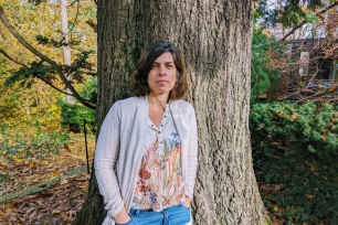 Lucila Scimone stands in front of a tree