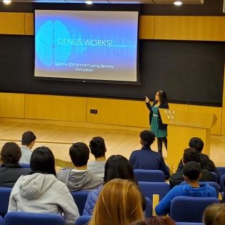 Students sit in a lecture hall.