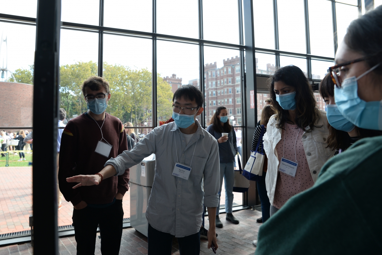 A person presents a poster.