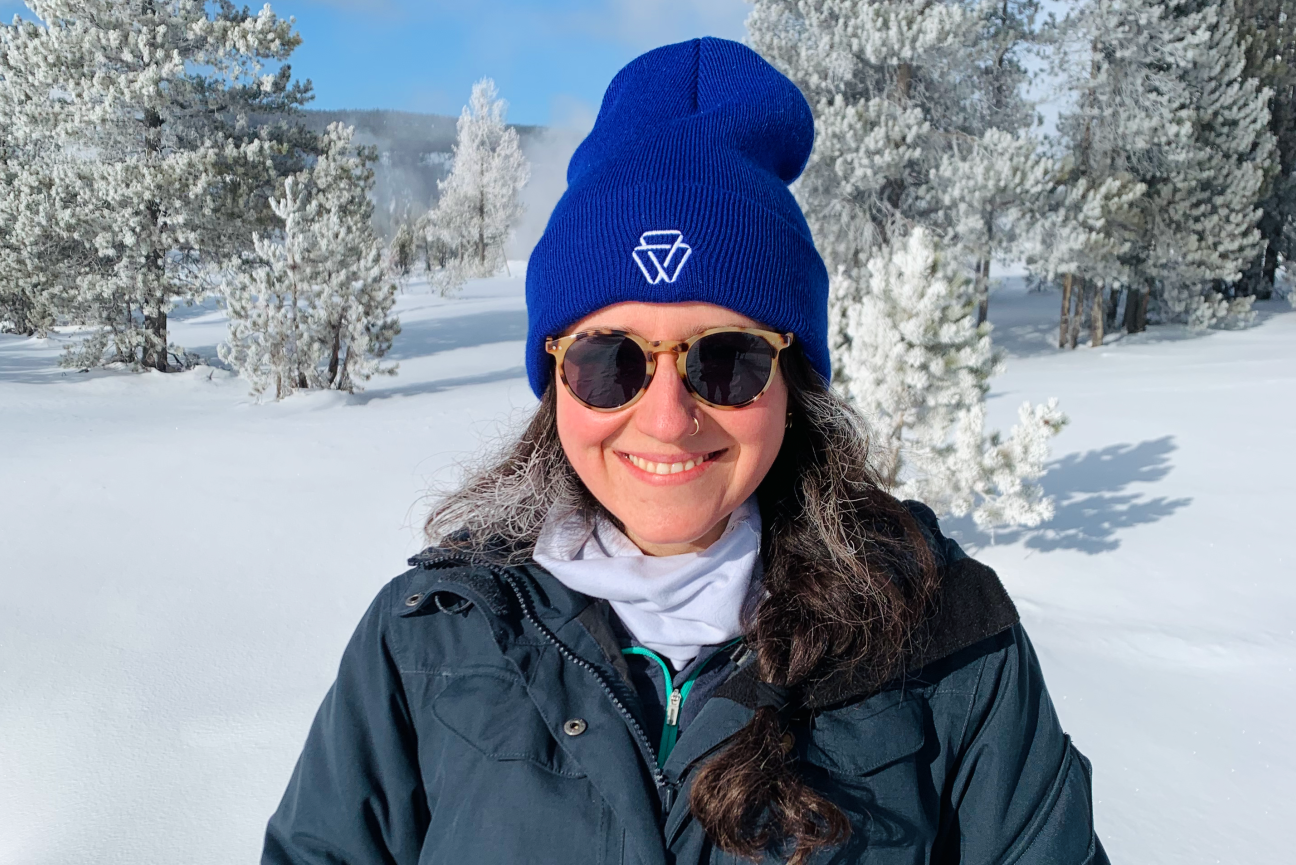 Haley Licon outside wearing a blue Whitehead Institute beanie
